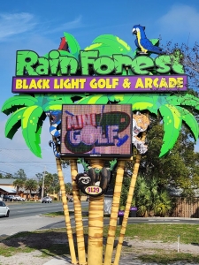 Primary image for the Lot 2/5 of 4 Tickets to Rain Forest Black Light Golf Panama city Beach or Mirimar Beach, Value $60 Auction Item